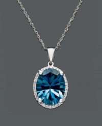 Take your style up a notch with bright, bold color. This brilliant oval-cut London blue topaz (4-1/10 ct. t.w.) sits in a shining 14k white gold setting with a sweet dusting of diamonds at the edges. Approximate length: 18 inches. Approximate drop: 5/8 inch.