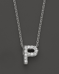 From the Tiny Treasures collection, a diamond P necklace. With signature ruby accent. Designed by Roberto Coin.