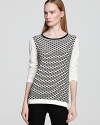 A mesh print lends eye-catching, graphic appeal to this Tibi sweater in a comfy knit.