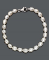 As necessary as a little black dress. This simple sterling silver bracelet features oblong cultured freshwater pearls (6-7 mm). Approximate length: 8 inches.