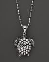 A playful sea turtle dangles from a sterling silver ball chain on this everyday necklace from Lagos.