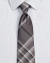 Smart checks in a sophisticated palette on pure Italian silk.About 3 wideSilkDry cleanMade in Italy