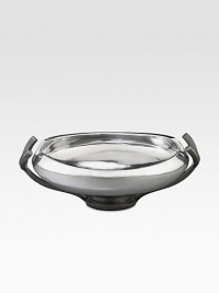 Crafted from stunning metal alloy, this lovely bowl artfully frames whatever you put in it with a gently curling lip, glossy shine and graceful pedestal base. From the Anvil Collection Iron-finish metal alloy 2-quart capacity 14¼W X 4H X 10D Hand wash Imported 