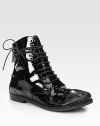 Extra long wrap-around laces add urban-cool style to this easy patent leather silhouette. Stacked heel, ¾ (20mm)Patent leather upperBack zipLeather lining and solePadded insoleMade in ItalyOUR FIT MODEL RECOMMENDS ordering one half size up as this style runs small. 