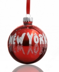 Have a New York ball. In shiny red with snow-white text and silver glitter dots, this cheery ornament celebrates the big city's busiest season.