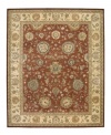 Bring new life to any room of your home. This gorgeous rug, sprouting intricate designs of vinery and blossoming flowers, opens up any space with warm tones of burnt red and beige. With an all-wool construction, accented with rich silk highlights, this stylish Nourison 2000 import is ultra-durable and luxuriously soft to the touch.