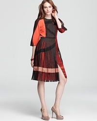 BCBGMAXAZRIA's fashion forward Layton dress wows in a color block design, finished with an innovative skirt and mesh accents.