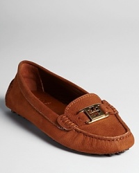 Tory Burch takes her everyday luxe approach into classic driving mocs with signature goldtone logos, in vibrant shades of suede that will step up your warm weather wardrobe.