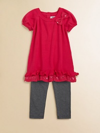 Sweet bows, sequins and ruffles adorn this adorable sweater tunic and leggings set.  Tunic Ribbed roundneckShort puff sleevesBow and sequin accentsRuffled hemBack keyhole with button closure Leggings Elastic waistbandPull-on styleTunic: cotton/acrylicLeggings: cotton/spandexMachine washImported