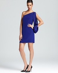 One-shouldered and split-sleeved, Nicole Miller's playful party dress shows off the season's love of jewel tones.