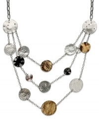 Drape your neckline in shimmering fashion. Alfani's currency-inspired necklace features three rows of circular pendants in silver, gold and hematite tones. Crafted in silver tone mixed metal. Approximate length: 19-1/2 inches + 3-inch extender. Approximate drop: 3 inches.