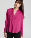 Articulated in luxe stretch silk, this airy Vince top transitions from season to season with effortless chic.