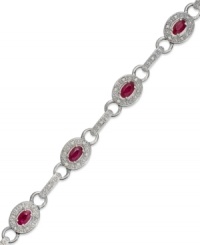 A beautiful combination. Rubies (2-1/2 ct. t.w.) and single-cut diamonds (1/4 ct. t.w.) come together in stunning fashion in this oval link bracelet. Set in sterling silver. Approximate length: 7 inches.