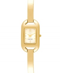 Sleek minimalism for everyday style from Nine West. Crafted of gold tone mixed metal bracelet and rectangular case. Champagne dial features gold tone dot markers, numerals at twelve and six o'clock, hour and minute hands, sweeping second hand and logo at six o'clock. Quartz movement. Limited lifetime warranty.