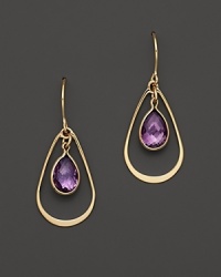 Bezeled amethyst teardrops, framed in 14K yellow gold.