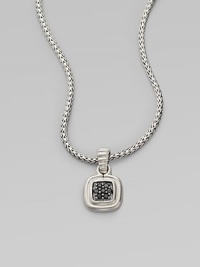 A square pendant with a sparkling black sapphire center on a braided sterling silver chain. Black sapphiresSterling silverLength, about 18Pendant size, about 1½ Lobster clasp closureImported 