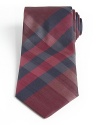 Add a finishing touch to any suit or dress shirt with this Burberry silk tie featuring a purple check print.