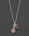 A twin heart necklace in pink and raspberry crystal framed in sterling silver. Designed by Judith Ripka.