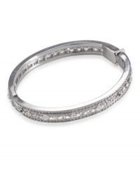 Let your inner-diva shine with this sparkling bangle by Carolee. Bracelet features silvertone mixed metal with diamond and circular-shaped glass crystals. Approximate diameter: 3-1/2 inches.