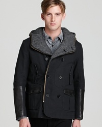 A smart mix of refined and sporty, this handsome coat features sleek leather details and unique pocket detailing to set your outdoor look apart.