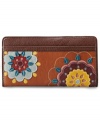 This free-spirited design from Fossil gives a nod to '70s flower power fashion. Rich leather is adorned with whimsical floral patchwork, while the pocket-lined interior organizes all your essentials