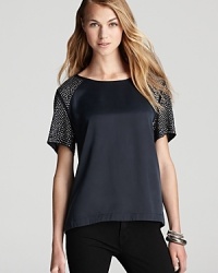 A silk Rebecca Taylor tee is dotted at the sleeves with edgy studs for a directional take on a laid-back style.