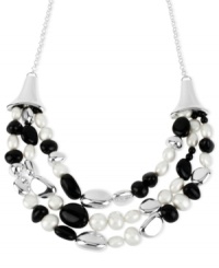 It's style times three in this frontal necklace from Robert Lee Morris. Crafted from silver-tone mixed metal, the necklace features black beads and simulated pearl accents layered along three rows. Approximate length: 21 inches + 3-inch extender. Approximate drop: 2-1/2 inches.