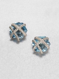 From the Cable Wrap Collection. An pretty, hexagon-shaped blue topaz stone wrapped in sterling silver cables and dazzling diamonds. Blue topazDiamonds, .07 tcwSterling silverSize, about .39Post backImported 