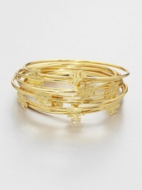 Stacked set of ten bangles with goldplated logo medallions for a simple, layered look. 16K goldplated brassDiameter, about 2½Slip-on styleImported