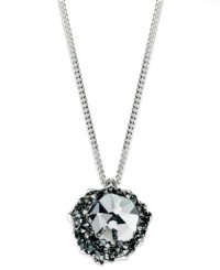 A modern treasure from Swarovski. This shimmering necklace flaunts a clear crystal pendant encrusted with Crystal Silvernight chatons. Crafted in rhodium-plated mixed metal. Approximate length: 14 inches + 2-inch extender. Approximate drop: 1/2 inch.