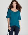 A side tie lends interest to this richly hued ALTERNATIVE top--the perfect companion to your favorite jeans.