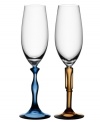 A perfect pair, the Two of Us flutes from Kosta Boda feature stems with a sense of humor. Tinted crystal with feminine curves and a masculine stature is a delight on display in addition to your table. A whimsical gift for the bride and groom!