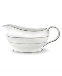 This elegant sauce boat is accented with a delicate flourish of vine-like, white-on-white imprints with raised, iridescent enamel dots. Holds 16 oz. 9 long. From Lenox's dinnerware and dishes collection.