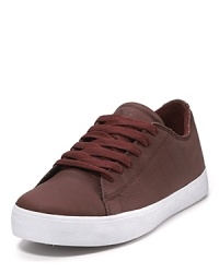 Skater-style from Supra, this soft satin tuf sneaker has a chunky rubber sole and wide footbed.