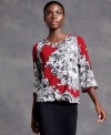 A unique print on this petite top from Alfani makes it stand out from the crowd. Pair with your favorite jeans or pants for a flattering look.