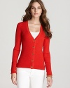 A fiery rush of hue, this Tory Burch cardigan ignites your daily dress code. Garnish with gold accents for standout style.