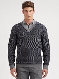 A well-knitted wool pullover sweater is printed in a textural, geometric pattern for a look that exudes modern elegance.V-neckRibbed knit cuffs and hemWoolMachine washImported