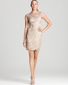 In a classic neutral hue, Sue Wong's short dress lends elegance with allover embellishments.