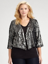 All eyes will be on you when you enter the room in this dazzling cropped design with shimmering sequins absolutely everywhere.Round necklineWide lapelsOpen frontThree-quarter sleevesCropped length with slight contour front hemAbout 12 from shoulder to hemViscoseSpot cleanImported