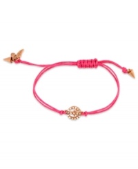 Give peace a chance. This RACHEL Rachel Roy bracelet showcases a peace sign charm with glass stone accents. An adjustable pink cotton cord holds it all together. Set in worn gold tone mixed metal. Approximate diameter: 1 inches. Adjustable from 1 inch to 7-1/4 inches.