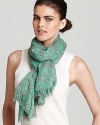 A sheer oblong scarf with linear MARC BY MARC JACOBS printed all over for a statement-making scarf style.