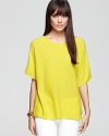 A short sleeve Vince sweater garners all the attention in a bright neon hue.