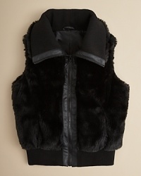 Cozy faux fur goes glam in this cute vest-layer it over a colorful long sleeve knit or sweater.