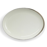 A hand-painted crescent of stunning platinum rims the edges of this thoroughly modern dinnerware collection.