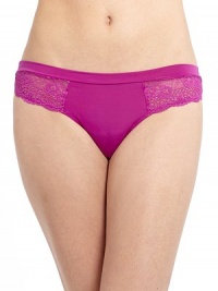 THE LOOKElastic banded waistSleek middle panelOpen weave lace detailsLow-rise thong silhouetteMesh backTHE MATERIAL84% polyester/16% spandexPartially linedCARE & ORIGINMachine washImported