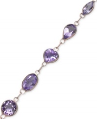 Add a royal touch to your look. Rich amethyst (6 ct. t.w.) in oval and round shapes shine bright against a 14k gold setting. Approximate length: 7 inches.