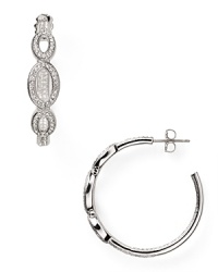 Crafted from rhodium plated metal and crystal stations, Nadri's open link hoop earrings encapsulate sophisticated accessorizing.