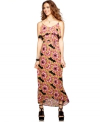 6 Degrees designs a maxi dress for the modern day flower child, teaming a billowy, ruffled neckline with a bold print that depicts flowers made from colorful feathers!