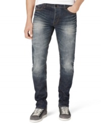 A white fade and distressed details give these Calvin Klein jeans a cool edgy style.