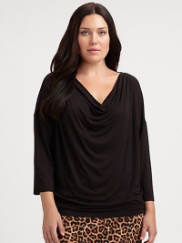 You will find this cowlneck top super flattering, thanks to its relaxed-yet-feminine fit and a hint of stretch. CowlneckThree-quarter sleevesPull-on styleAbout 29 from shoulder to hem95% rayon/5% spandexMachine washImported